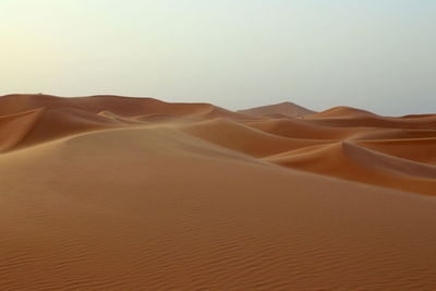 Scenic view of desert against clear sky