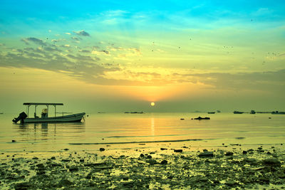 Scenic view of sea against sky during sunset