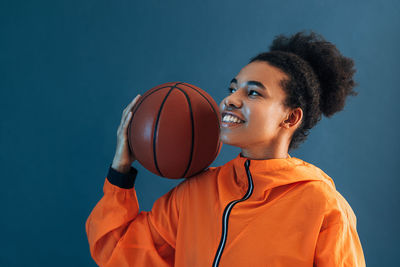 Young man playing basketball