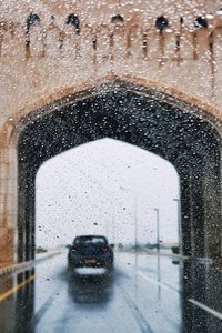 Water drops on car windshield during rainy season