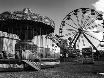 Low angle view of ferris wheel against sky