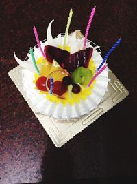 High angle view of fruits on cake