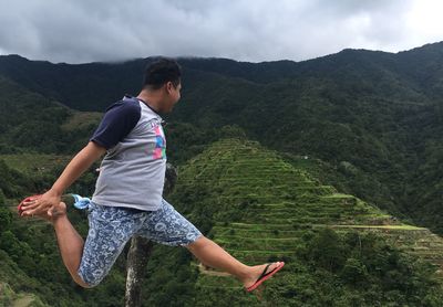 Woman on mountains against plants