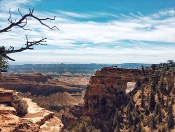 Scenic view of landscape against cloudy sky