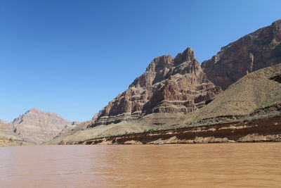 Scenic view of mountains against clear blue sky