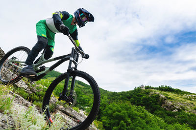 Professional cycling. downhill descent from the mountains by bicycle. young rider going down the