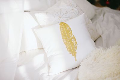 High angle view of cushions on bed at home