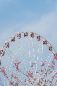 Low angle view of ferris wheel against clear sky