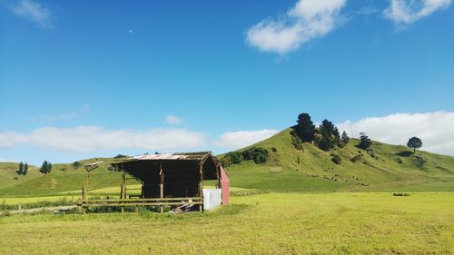Built structure on field against sky