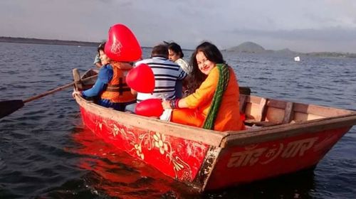 People sitting on boat in sea