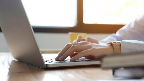 Man using laptop on table