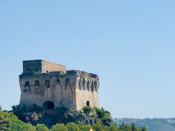 Low angle view of fort against blue sky