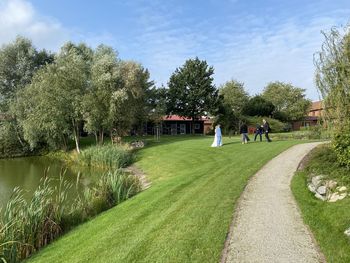 Panoramic view of trees and houses against sky