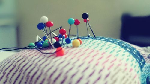 Close-up of straight pins on pin cushion