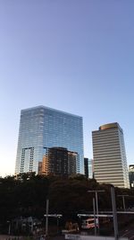 Low angle view of skyscrapers against clear sky