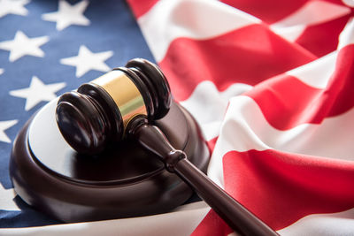 Close-up of gavel on american flag