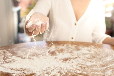 Midsection of woman preparing food