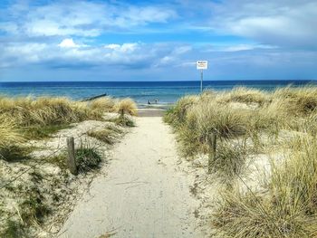 Scenic view of sea against cloudy sky