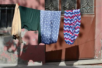 Clothes drying against wall