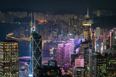 Aerial view of city lit up at night