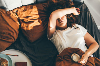 Midsection of woman holding coffee