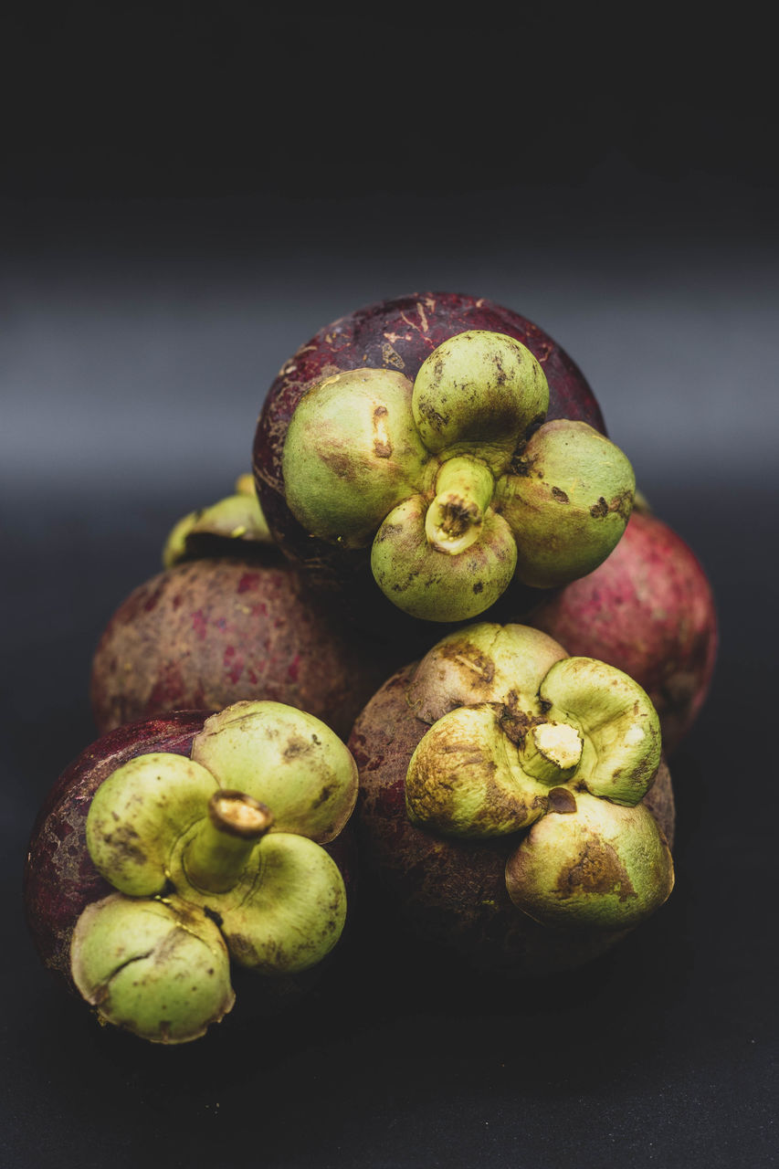 CLOSE-UP OF FRUITS ON TABLE