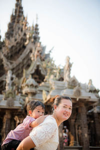 Portrait of mother and girl wearing mask