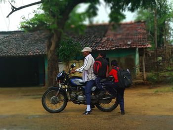 Man riding motorcycle on cart