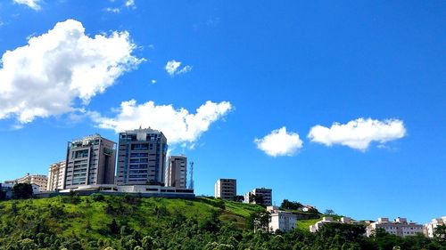 Low angle view of buildings against blue sky