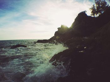 Scenic view of sea against cloudy sky