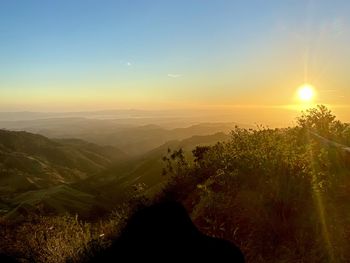 Scenic view of mountains against sky during sunset