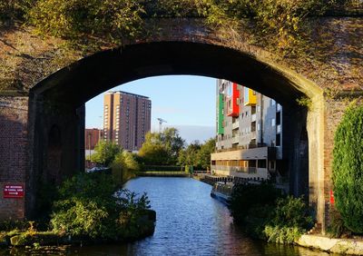 View of bridge in city against sky