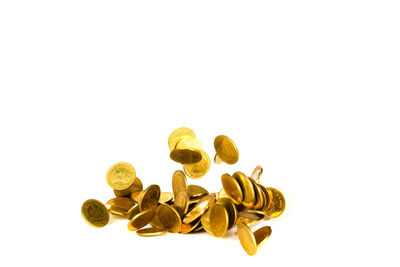 Close-up of coins on white background