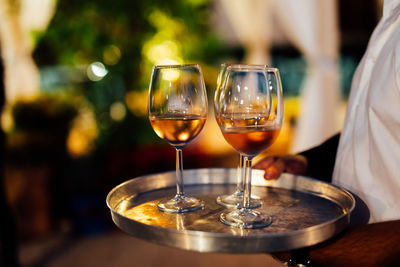 Luxury table settings for fine dining with and glassware, pouring wine to glass. 