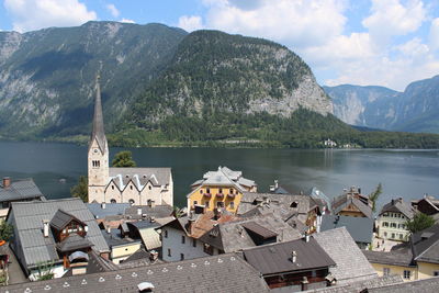 Buildings in a lake with mountain range in background