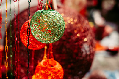 Close-up of christmas decorations hanging for sale in market