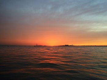 Scenic view of sea at sunset