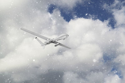 Low angle view of airplane flying in sky
