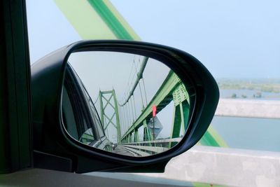 Reflection of sky on side-view mirror