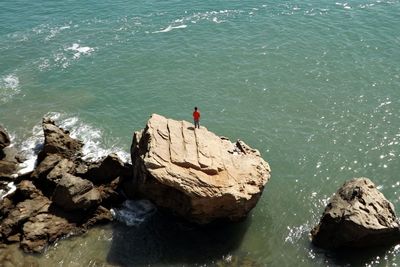 High angle view of rocks in sea