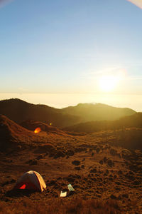 Scenic view of landscape against sky during sunset