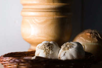 Close-up of bread on table against white background