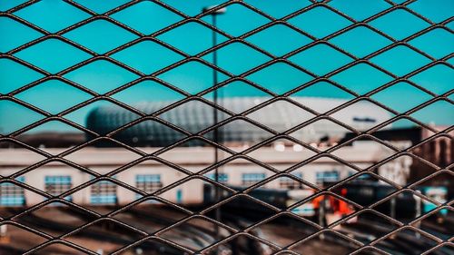 Full frame shot of chainlink fence against sky