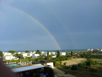 Low angle view of houses against cloudy sky