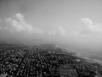 Aerial view of cityscape against sky