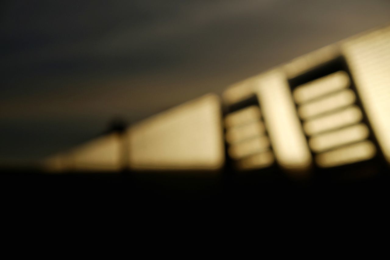 CLOSE-UP OF ELECTRIC LIGHTS ON BRIDGE