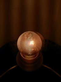 Close-up of illuminated light bulb