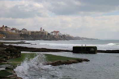 Scenic view of sea against cloudy sky