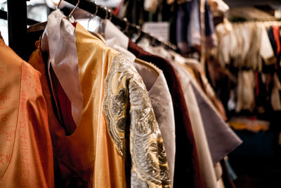 Low angle view of clothes hanging in store