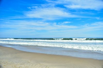 Scenic view of beach against sky